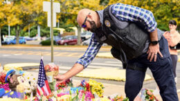 Officer lays flowers for fallen Officers